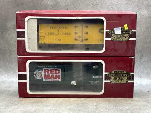 Two Delton Lines G-scale model train box cars in original boxes