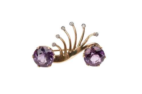 A vintage amethyst and diamond brooch in 9 carat yellow gold