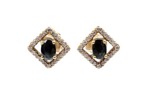 A pair of sapphire and diamond earrings in 18 carat yellow gold