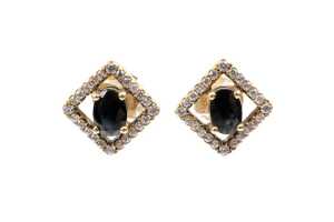 A pair of sapphire and diamond earrings in 18 carat yellow gold