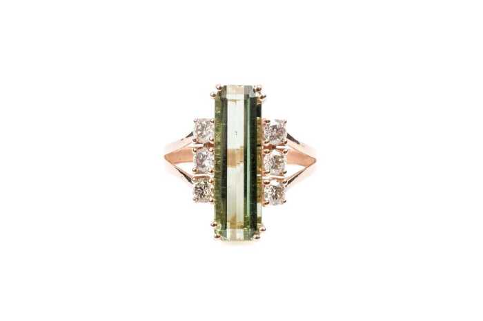 A green tourmaline and diamond ring in 9 carat rose gold