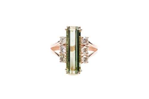 A green tourmaline and diamond ring in 9 carat rose gold