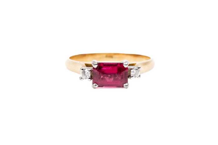 A red spinel and diamond ring in 18 carat yellow gold