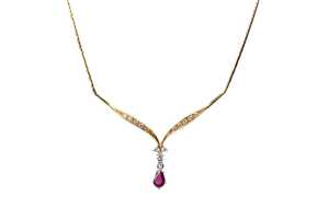A ruby and diamond necklace in 18 carat yellow gold