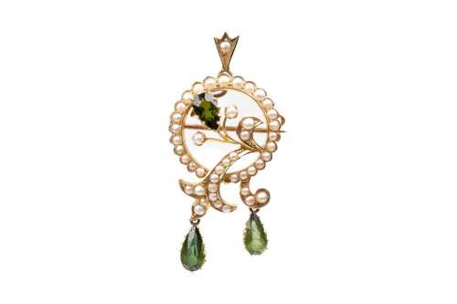 An antique peridot and seed pearl brooch/ pendant in 15 carat yellow gold