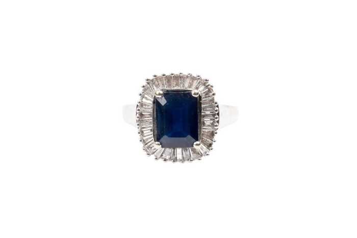 A sapphire and diamond ring in 14 carat white gold