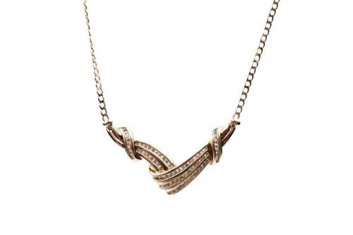 A diamond necklace in 9 carat yellow gold