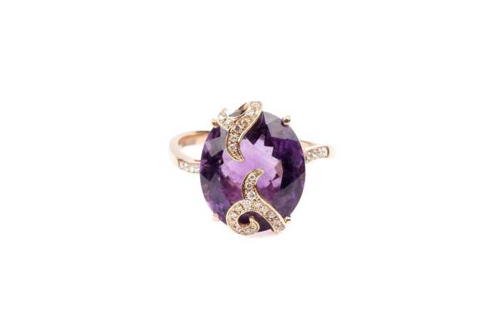 An amethyst and diamond ring in 18 carat rose gold