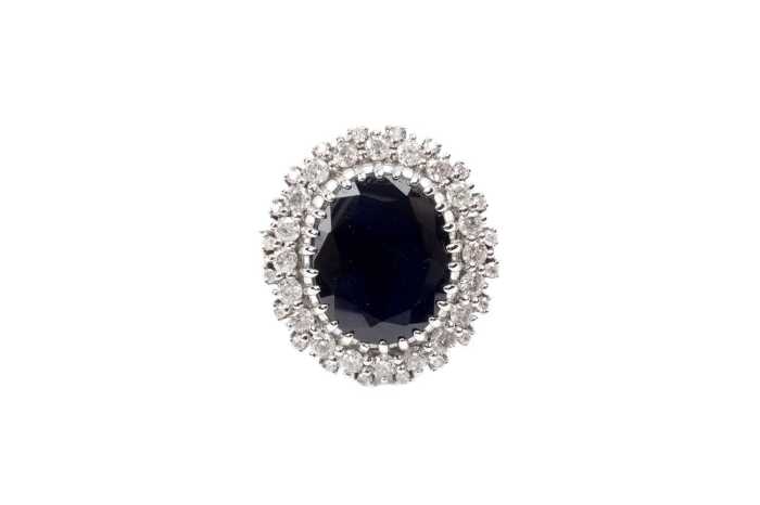 A sapphire and diamond ring in 14 carat white gold