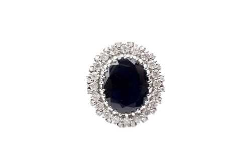 A sapphire and diamond ring in 14 carat white gold