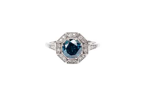 A treated blue and white diamond ring in 14 carat white gold