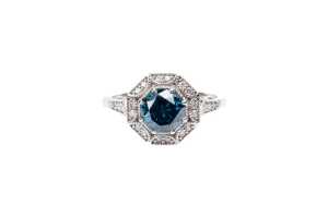 A treated blue and white diamond ring in 14 carat white gold