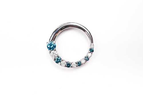 A white and treated blue diamond pendant in 14 carat white gold