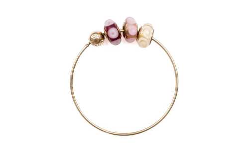 A Pandora bangle with three Murano glass charms in 14 carat yellow gold