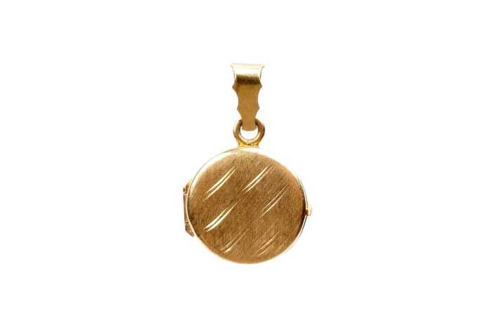 A round patterned locket in 18 carat yellow gold