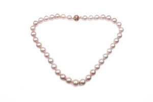 A strand of pink freshwater pearls to a 14 carat rose gold diamond clasp
