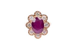 A ruby and diamond ring in 9 carat rose gold