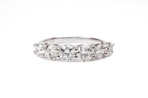 A diamond eternity ring in 14 carat white gold