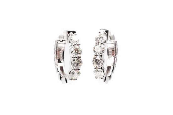 A pair of diamond hoops in 14 carat white gold
