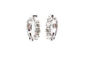A pair of diamond hoops in 14 carat white gold