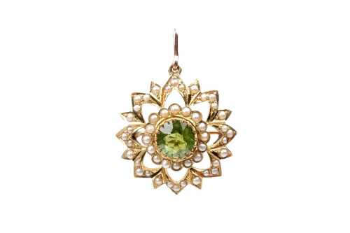 An antique peridot and seed pearl brooch in 15 carat yellow gold