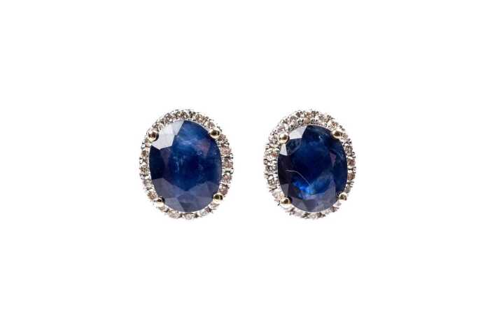 A pair of sapphire and diamond earrings in 14 carat yellow gold