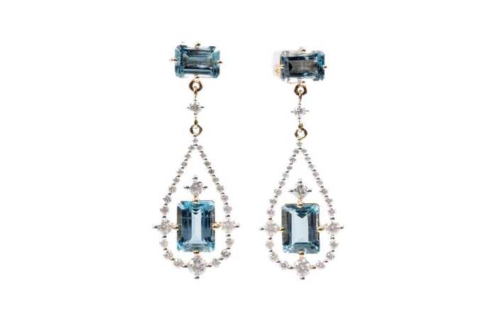 A pair of aquamarine and diamond earrings in 14 carat yellow gold