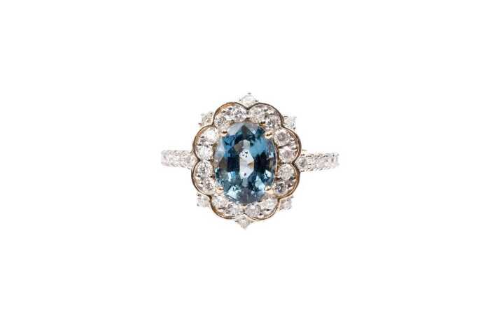 A Ceylon sapphire and diamond ring in 14 carat yellow gold