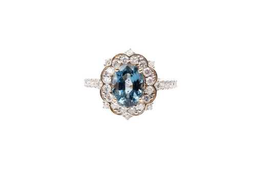 A Ceylon sapphire and diamond ring in 14 carat yellow gold