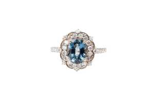 A Ceylon sapphire and diamond ring in 14 carat yellow gold