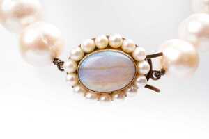 An Opera length strand of pearls to an opal and pearl clasp in 9 carat yellow gold - 2