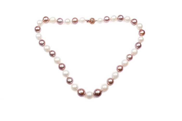 A strand of South sea and freshwater pearls to a 14 carat rose gold diamond clasp