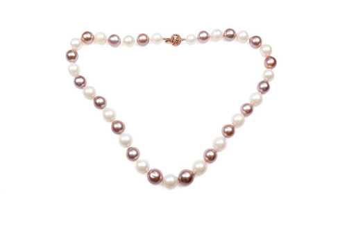 A strand of South sea and freshwater pearls to a 14 carat rose gold diamond clasp
