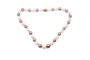 A strand of South sea and freshwater pearls to a 14 carat rose gold diamond clasp