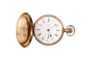 An antique Waltham pocket watch in 14 carat yellow gold