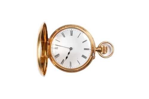 An antique half hunter pocket watch in 18 carat yellow gold