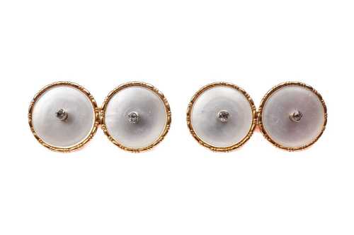 A pair of vintage mother of pearl and white sapphire cufflinks in 14ct yellow gold.