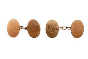 A pair of antique oval cufflinks in 15 carat yellow gold