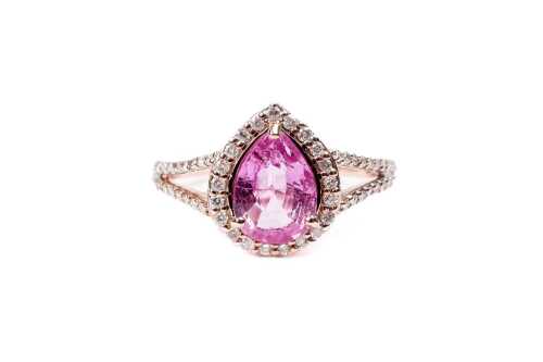 A pink sapphire and diamond ring in 14 carat rose gold