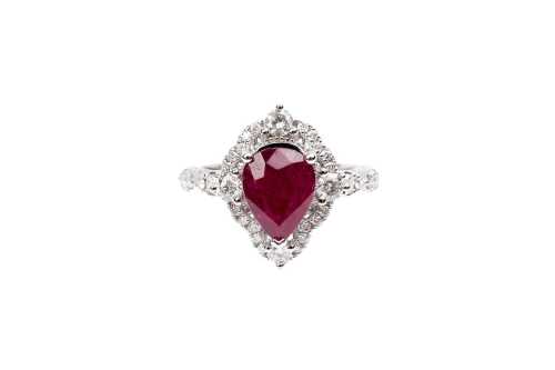 A ruby and diamond ring in 14 carat white gold