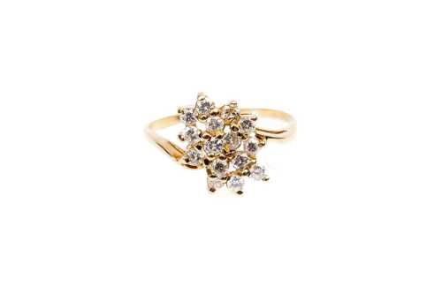 A diamond ring in 18 carat yellow gold