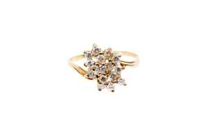 A diamond ring in 18 carat yellow gold