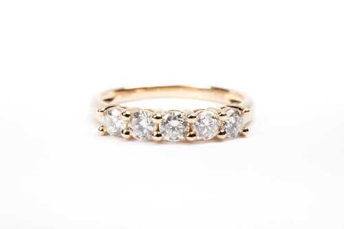 A diamond ring in 14 carat yellow gold