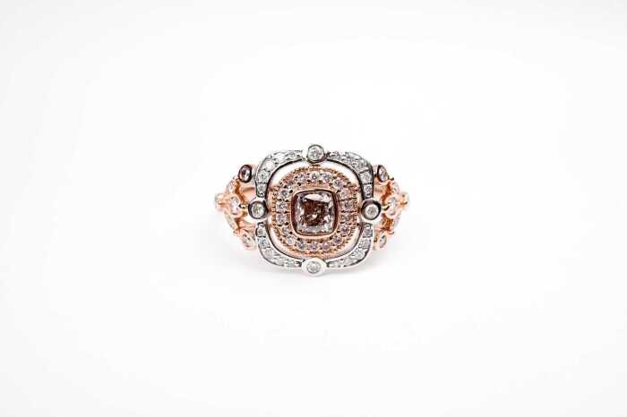 A pink and white diamond ring in 14 carat white and rose gold