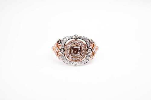 A pink and white diamond ring in 14 carat white and rose gold