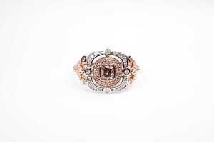 A pink and white diamond ring in 14 carat white and rose gold