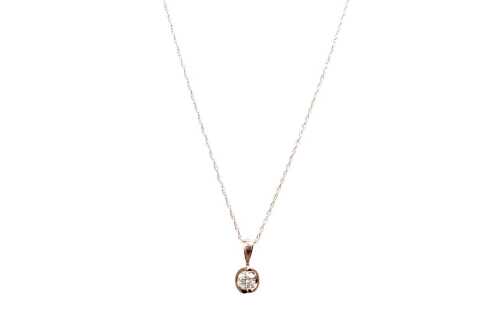 A diamond pendant and necklace in 14 carat rose gold