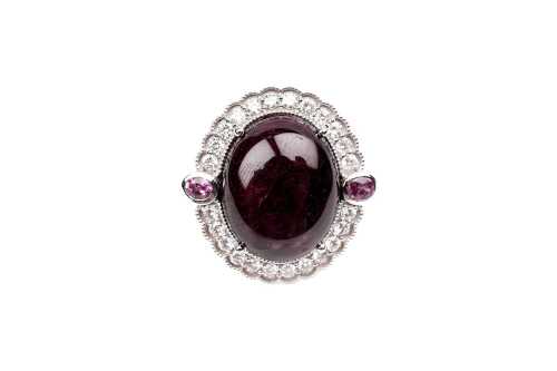 A ruby, pink sapphire, and diamond ring in 18 carat white gold