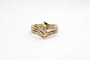 A diamond ring set in 18 carat yellow gold