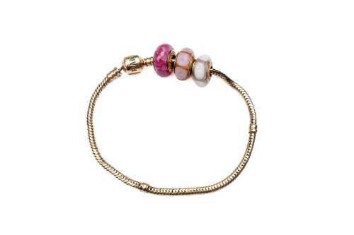 A rare Pandora bracelet with three Murano glass charms in 14 carat yellow gold